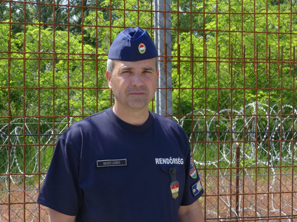 Police colonel Levente Baukó standing in front of the border security fence on the Hungarian border near Röszke. (Photo: FactRefuge / Mariska Mediahuis)