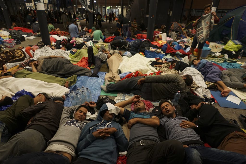Syrian refugees having rest at the floor of Keleti railway station. Refugee crisis. Budapest, Hungary, Central Europe, 5 September 2015 (Photo: Mstyslav Chernov / Wikimedia Commons)