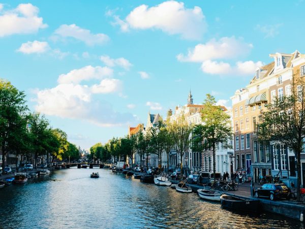Embankment of river between old buildings in downtown' Photo: Adrien Olichon on Pexels.