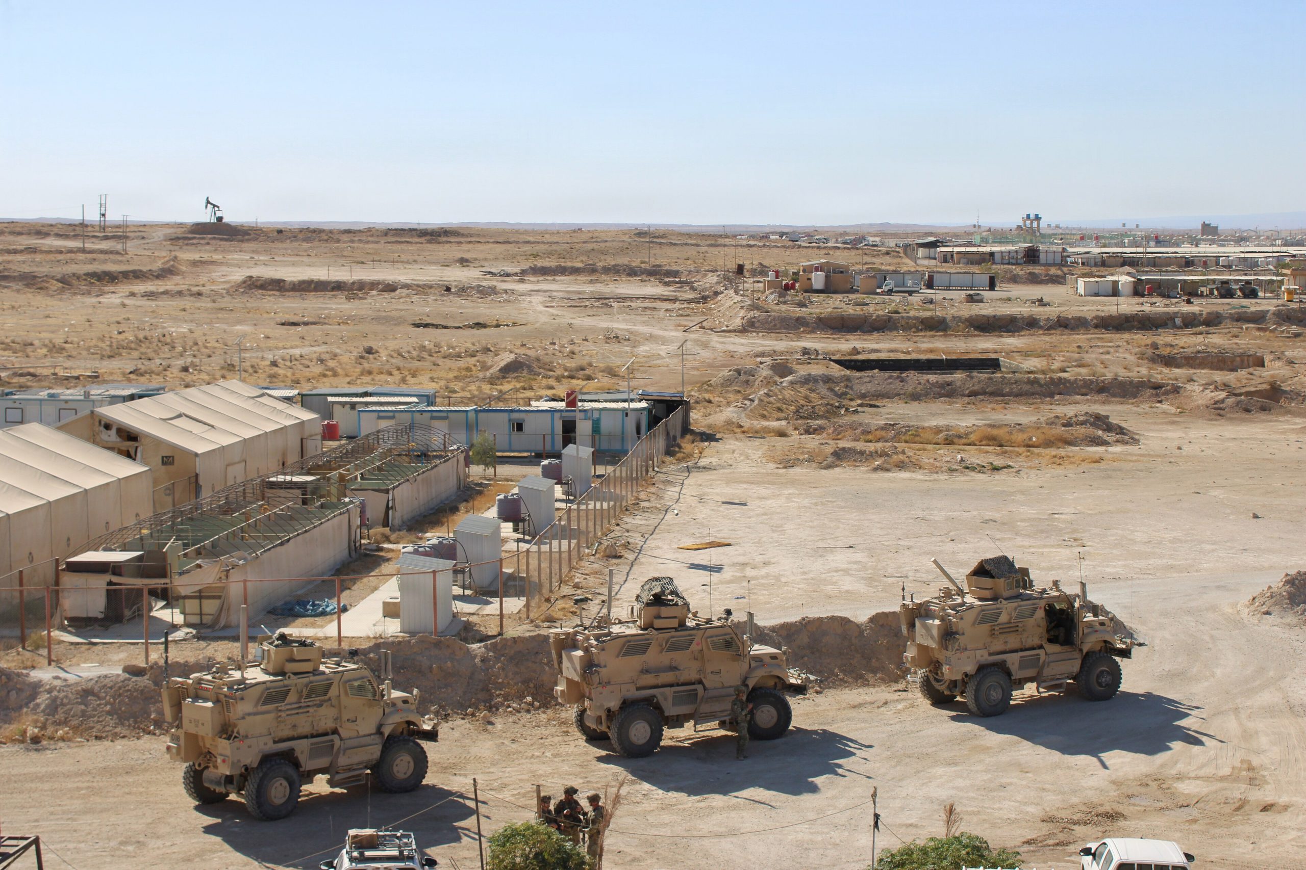 Mine-resistant, ambush-protected (MRAP) vehicles carrying a multinational diplomatic delegation, French air force Brig. Gen. François Tricot, CJ9 director with Combined Joint Task Force – Operation Inherent Resolve, and coalition troops enter Al-Hol camp in northeast Syria, Oct. 14, 2025. Photo: French Air Force Photo by 2nd Lt. Lena Adam / United States Air Force 9417412 / Wikimedia Commons, Public Domain.