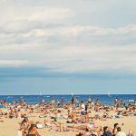 Crowded Barcelona beach. Photo source: Unsplash / Wikimedia Commons.