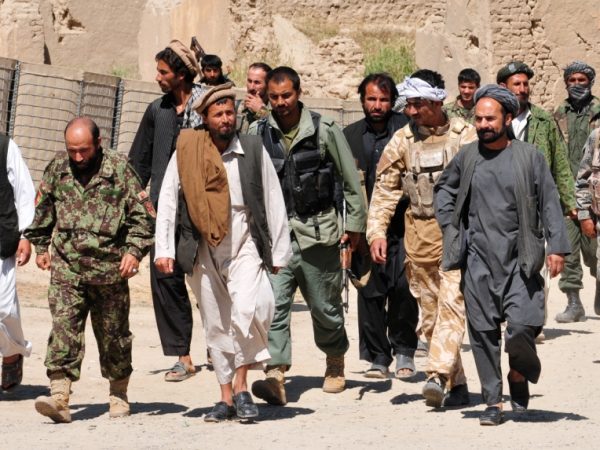 Taliban insurgents turn themselves in to Afghan National Security Forces at a forward operating base in Puza-i-Eshan, 2010. Photo source: ISAF Public Affairs / ResoluteSupportMedia / Flickr, CC BY 2.0