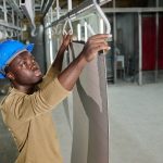 African,Worker,Working,With,Products,In,Workshop