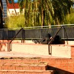 Migrants asleep on a bench in Valencia Park, Spain. Photo source: Maksim Safaniuk / Shuterstock.