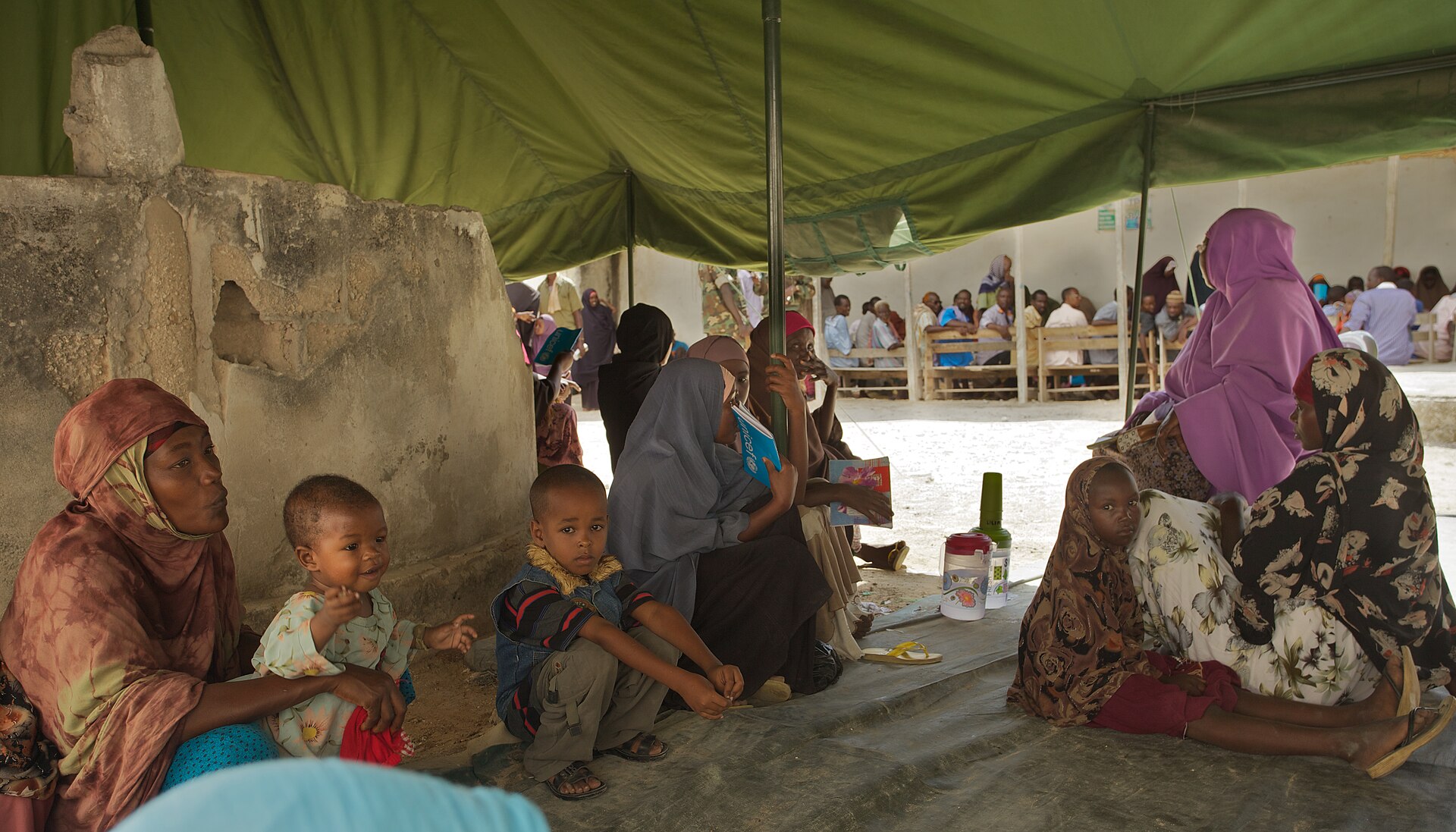Somali families wait for treatment at the AMISOM Outpatients Department. Somali families wait for treatment at the AMISOM OUtpatients Department